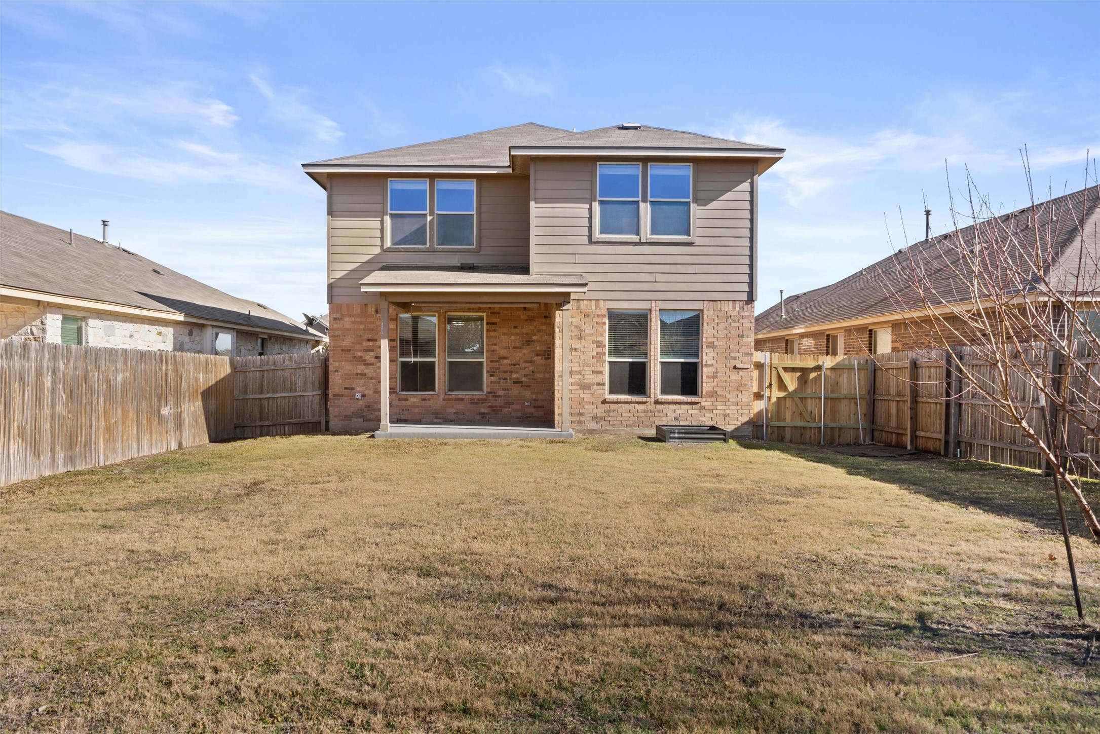 18120 Moreto Loop Pflugerville, TX 78660 - Photo 27 of 29 a front view of a house with a yard