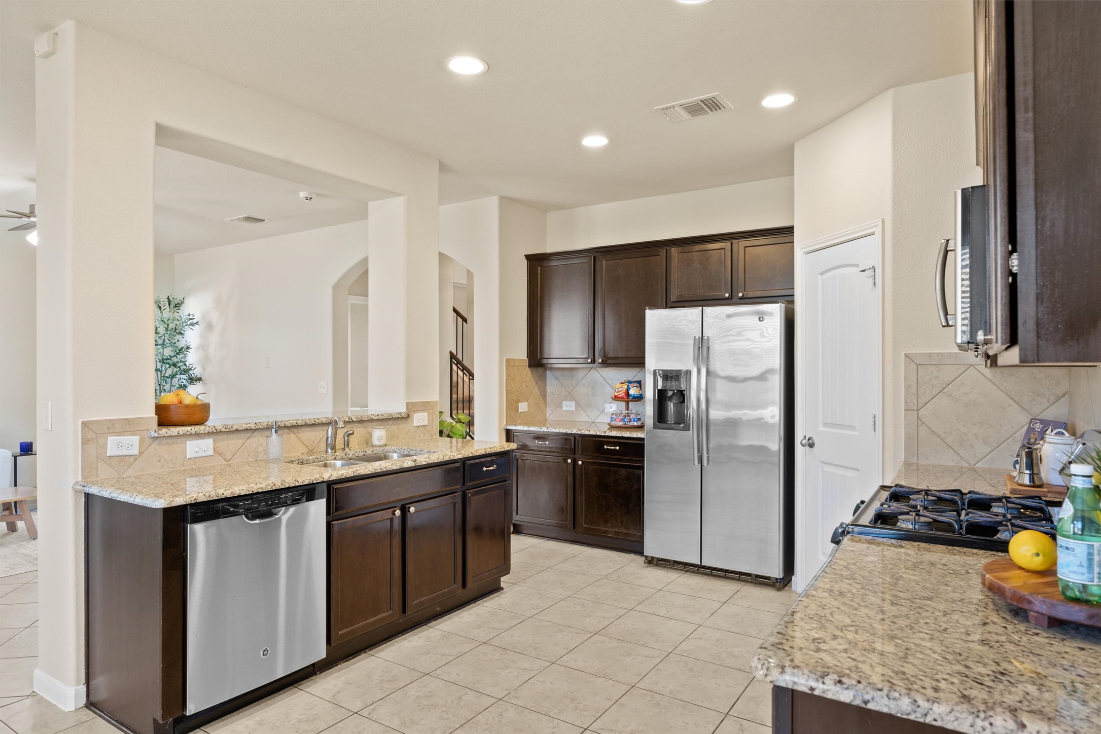 18120 Moreto Loop Pflugerville, TX 78660 - Photo 7 of 29 a kitchen with a sink stove and refrigerator