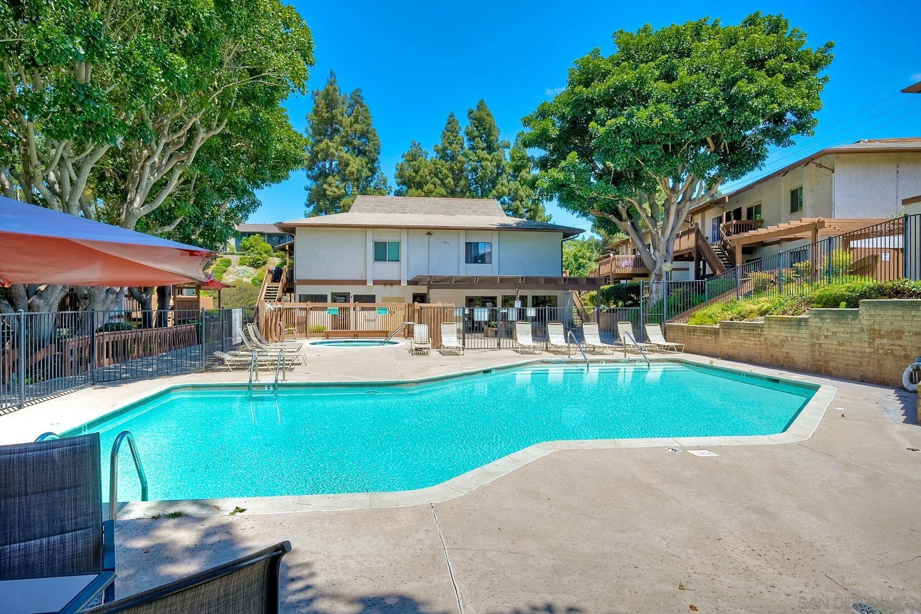 6358 Rancho Mission Road, Unit 623 San Diego, CA 92108 - Photo 14 of 21 a view of a house with swimming pool and sitting area