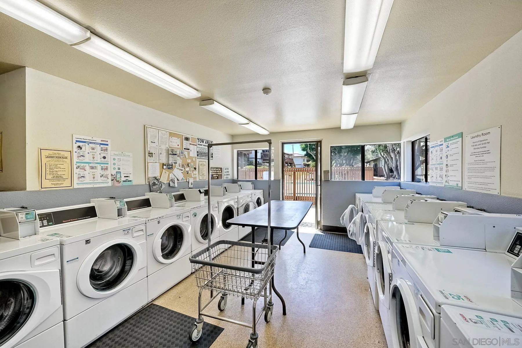6358 Rancho Mission Road, Unit 623 San Diego, CA 92108 - Photo 17 of 21 a living room with furniture and a clock