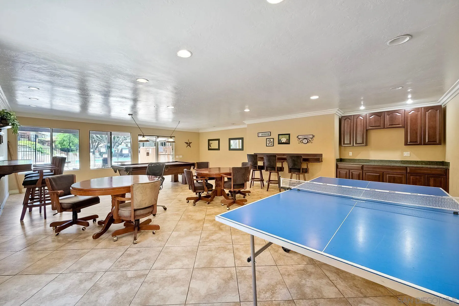 6358 Rancho Mission Road, Unit 623 San Diego, CA 92108 - Photo 18 of 21 a living room with furniture pool table and a large window