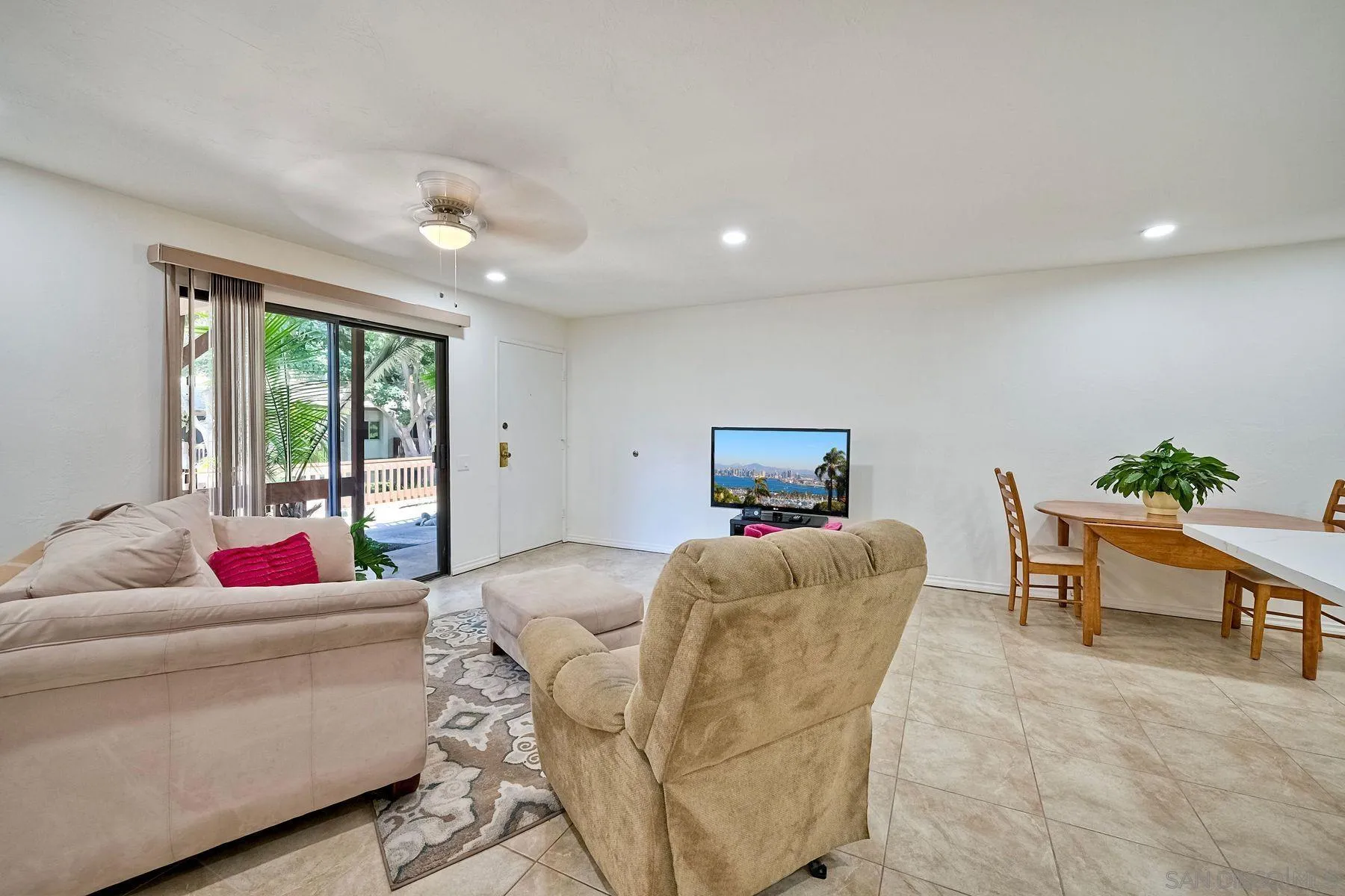 6358 Rancho Mission Road, Unit 623 San Diego, CA 92108 - Photo 4 of 21 a living room with furniture and a large window