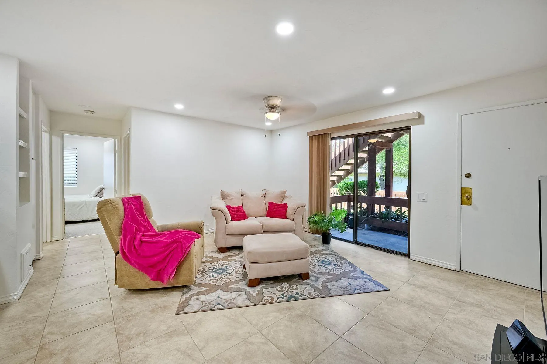 6358 Rancho Mission Road, Unit 623 San Diego, CA 92108 - Photo 5 of 21 a living room with furniture and a rug