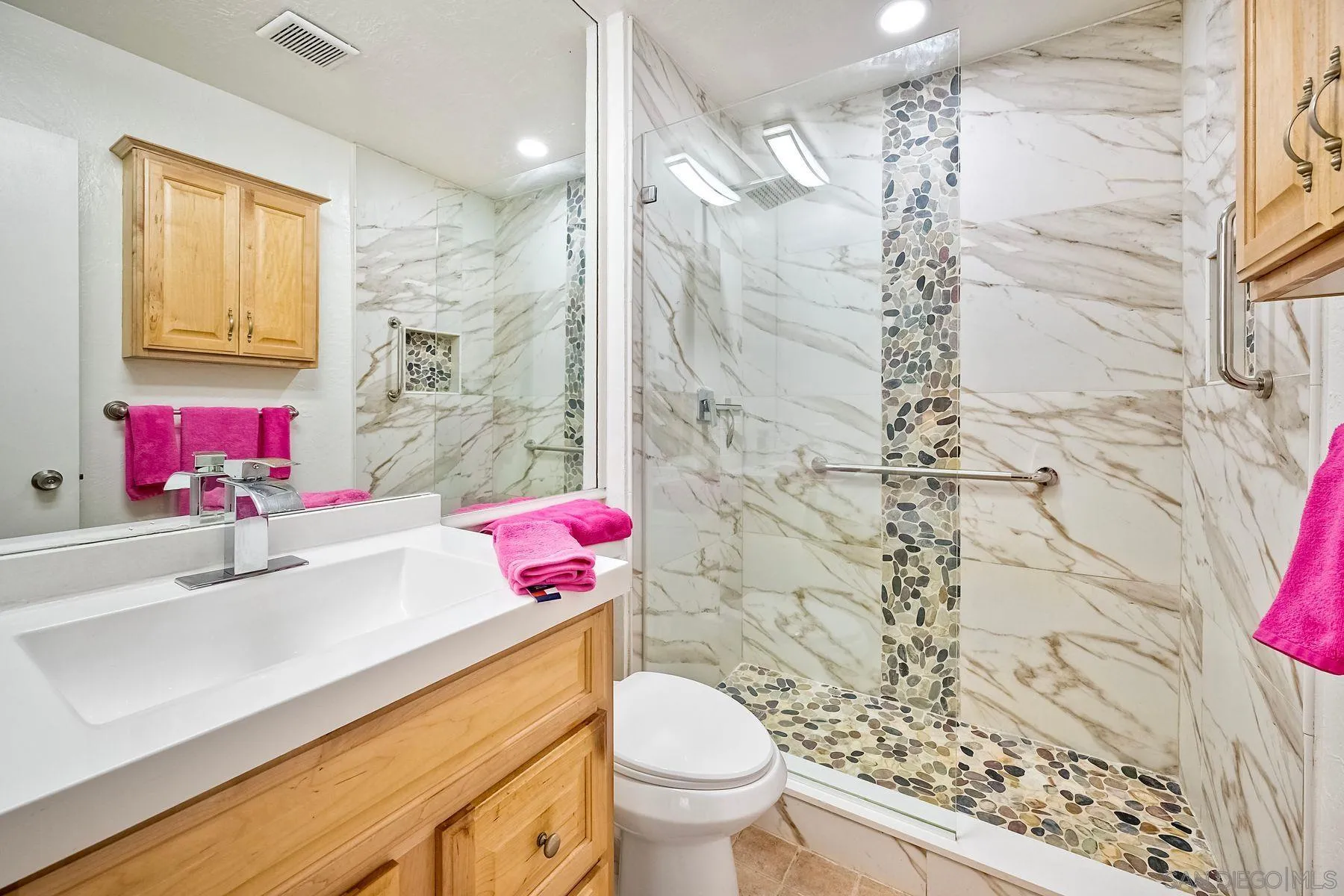6358 Rancho Mission Road, Unit 623 San Diego, CA 92108 - Photo 8 of 21 a bathroom with a sink toilet vanity and shower