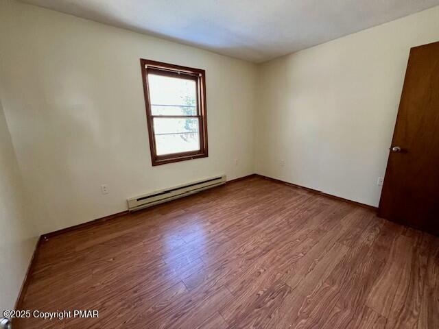 127 Louise Lane Bartonsville, PA 18321 - Photo 12 of 19 an empty room with wooden floor and windows