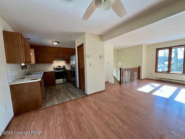 127 Louise Lane Bartonsville, PA 18321 - Photo 4 of 19 a view of a kitchen with wooden floor and a refrigerator