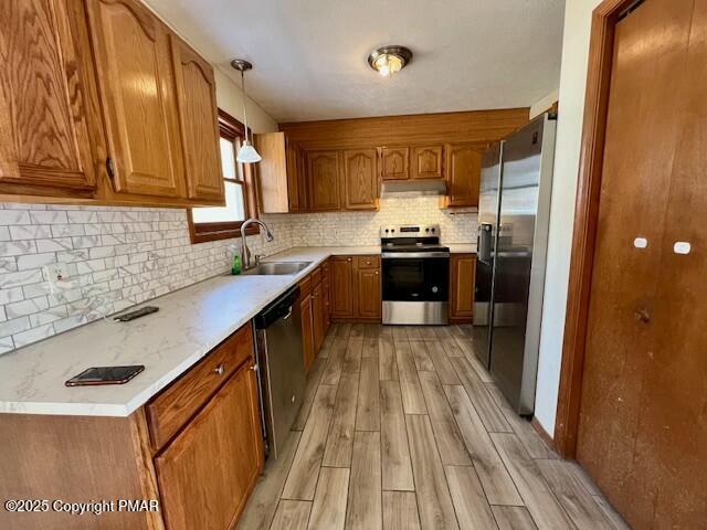 127 Louise Lane Bartonsville, PA 18321 - Photo 6 of 19 a kitchen with stainless steel appliances a sink stove and refrigerator