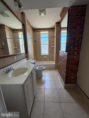 a bathroom with a sink a vanity and a mirror
