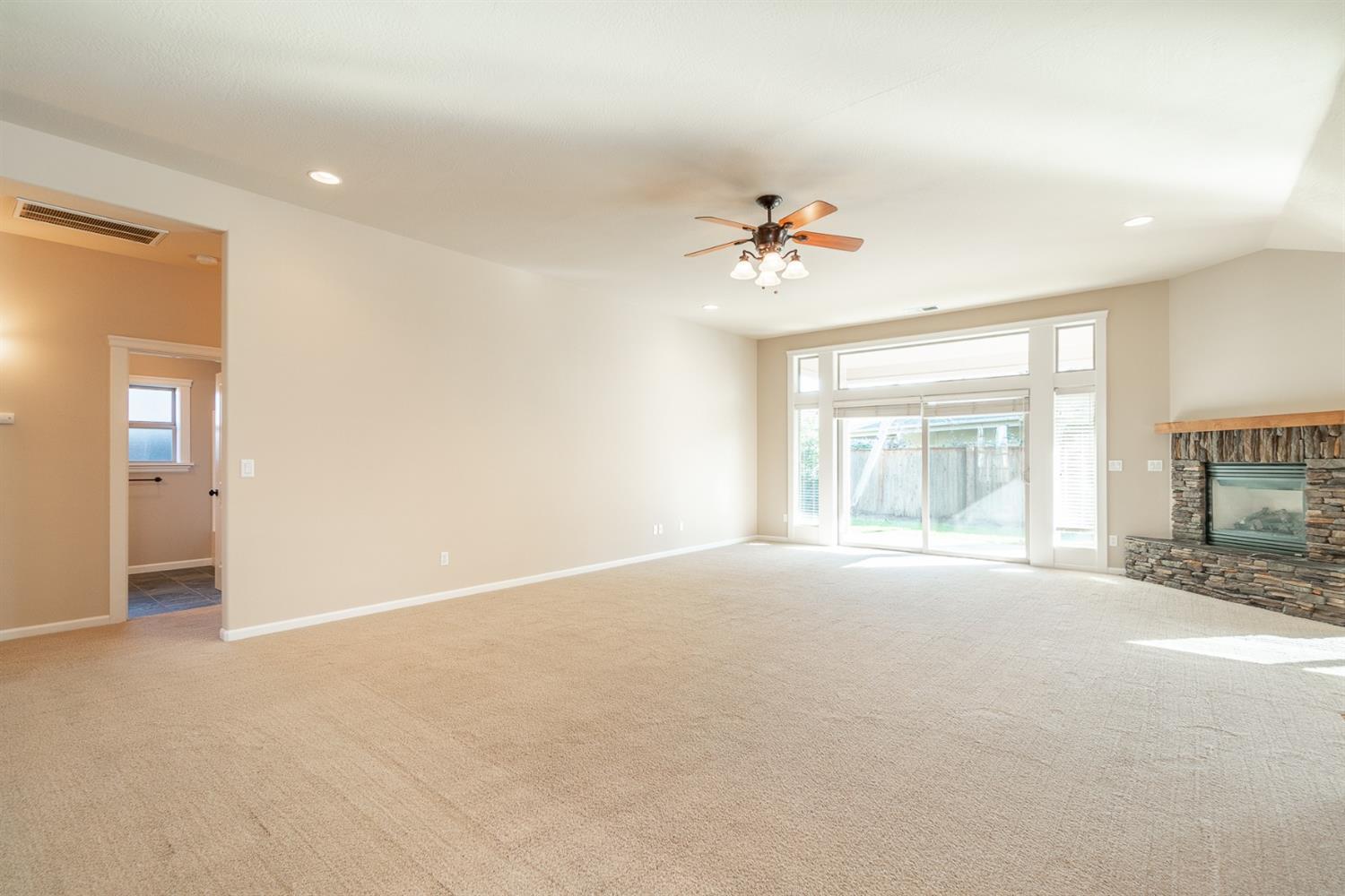 946 Pumpkin Ridge Eagle Point, OR 97524 - Photo 9 of 31 a view of an empty room with a window