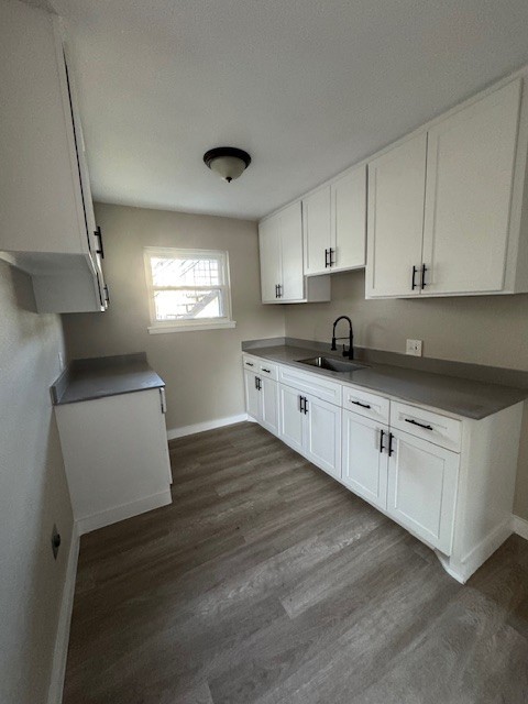 4706 Yellowstone Boulevard, Unit 12 Houston, TX 77021 - Photo 7 of 23 a kitchen with granite countertop white cabinets and white appliances