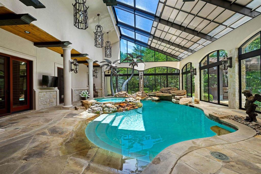 2115 Paradise Rnch Trail McKinney, TX 75071 - Photo 9 of 40 Indoor swimming pool with spa, surrounded by expansive flagstone flooring