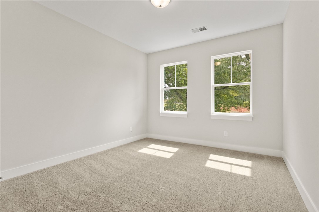 315 Old Shirley Road Central, SC 29630 - Photo 9 of 26 This airy room offers a tranquil escape, featuring natural light and comfortable carpeting.