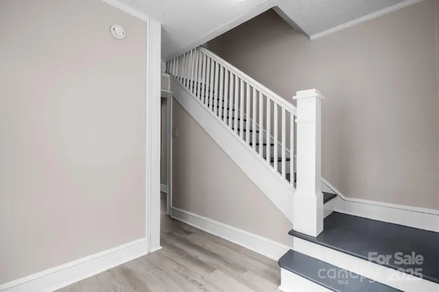 a view of entryway with wooden floor
