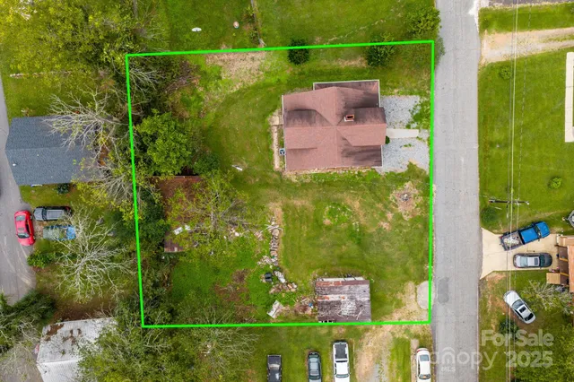 an aerial view of a house with a garden