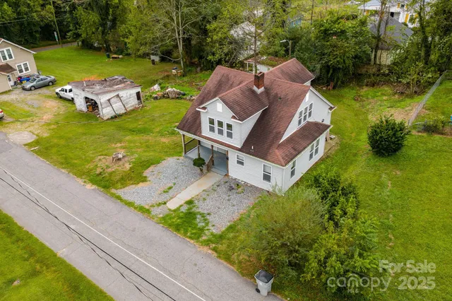 a view of a table and chairs with wooden fence