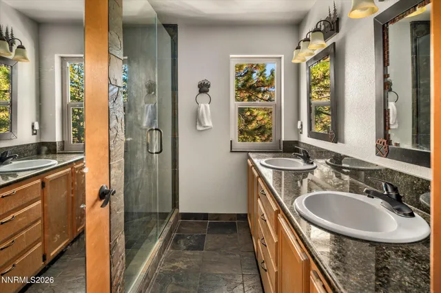 a bathroom with a sink a vanity and a mirror