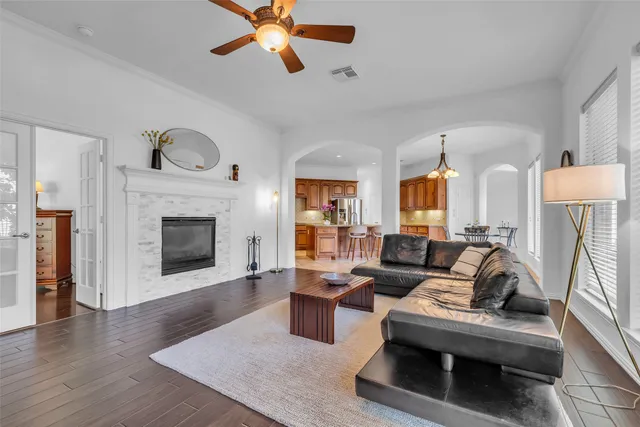 a living room with furniture and a fireplace