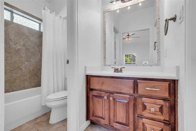 a bathroom with a sink a toilet and a bathtub
