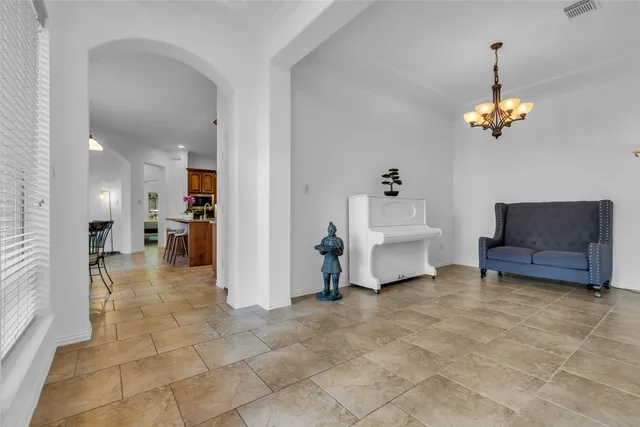 a view of a livingroom with furniture and a chandelier