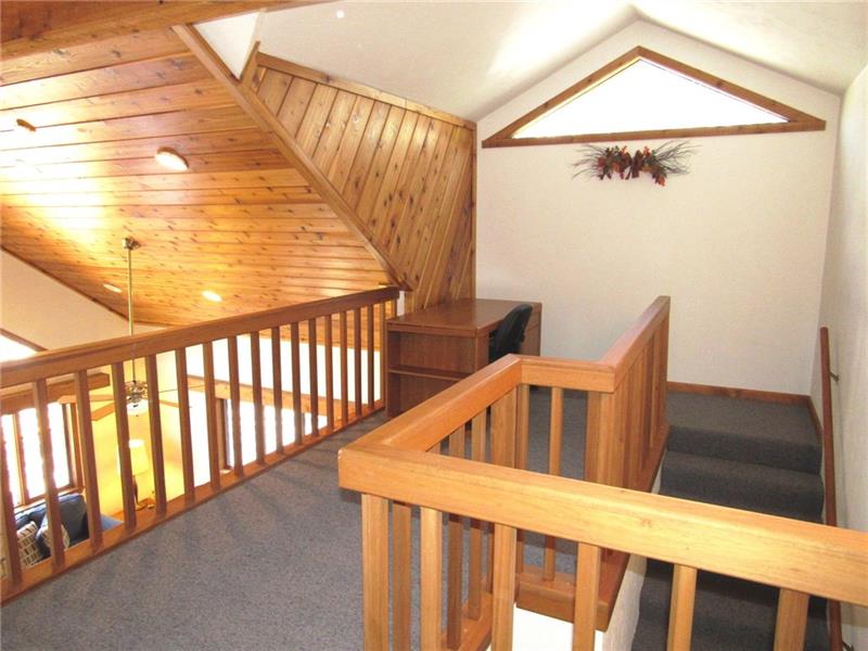 354 Lake Road Somerset, PA 15502 - Photo 13 of 25 Open railings allow the air to circulate and give the rooms a more open feeling! The master bedroom and bath are the only rooms on this level.