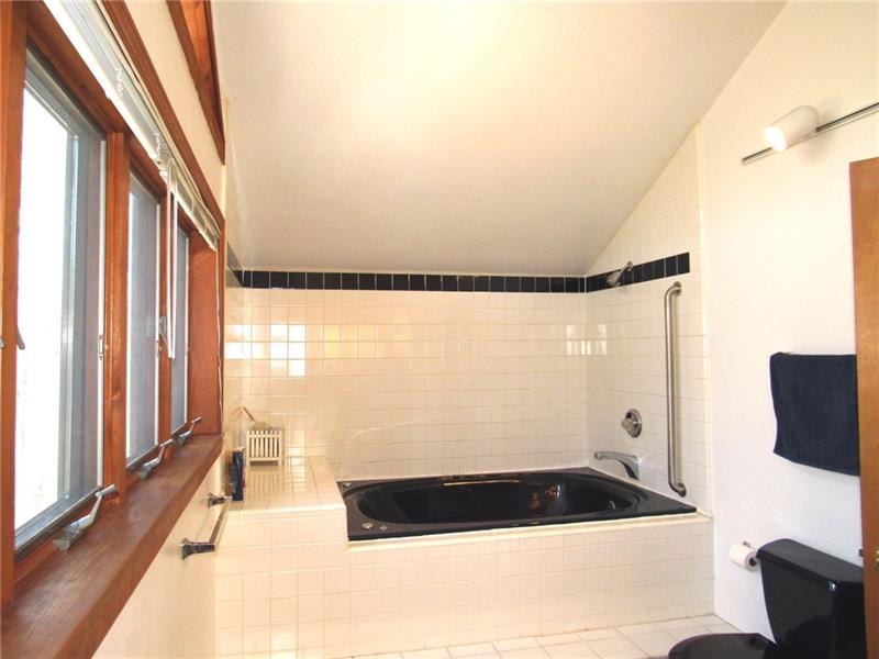 354 Lake Road Somerset, PA 15502 - Photo 16 of 25 Do you feel your achy muscles telling you to jump in?? Note the ceramic tile surrounding the tub and on the floor. Let's head downstairs to the rest of the home!