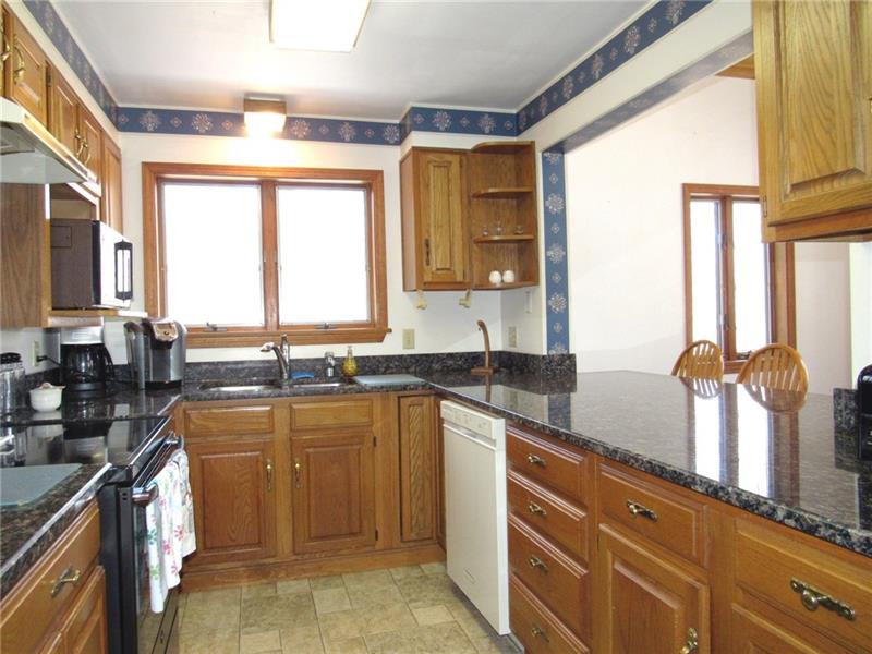 354 Lake Road Somerset, PA 15502 - Photo 3 of 25 There's also a pantry off to the right. The kitchen window faces out to the woods and there's an instra-hot water dispenser! Appliances are included, the range is new.