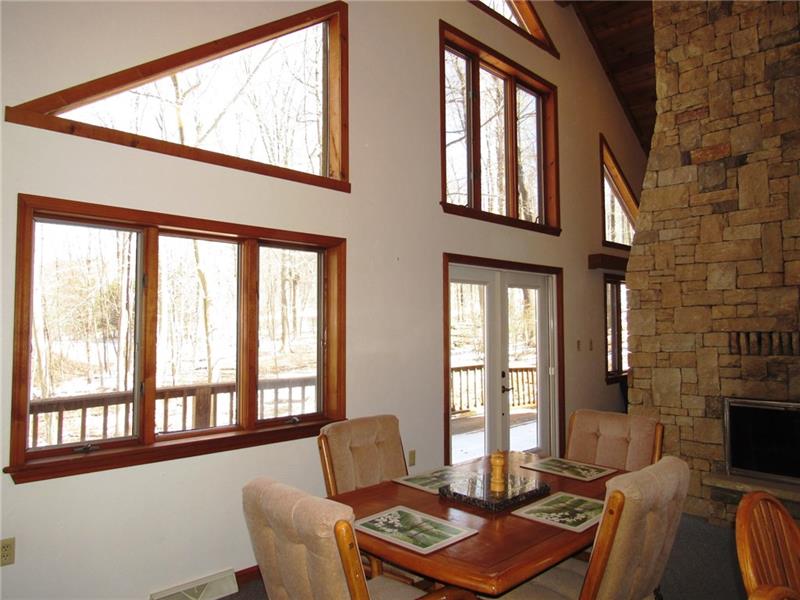 354 Lake Road Somerset, PA 15502 - Photo 4 of 25 Inside or out on the balcony, you'll enjoy your morning cup of Joe with the sun shining in through all of this glass! There's a retractable screen door for the French door.