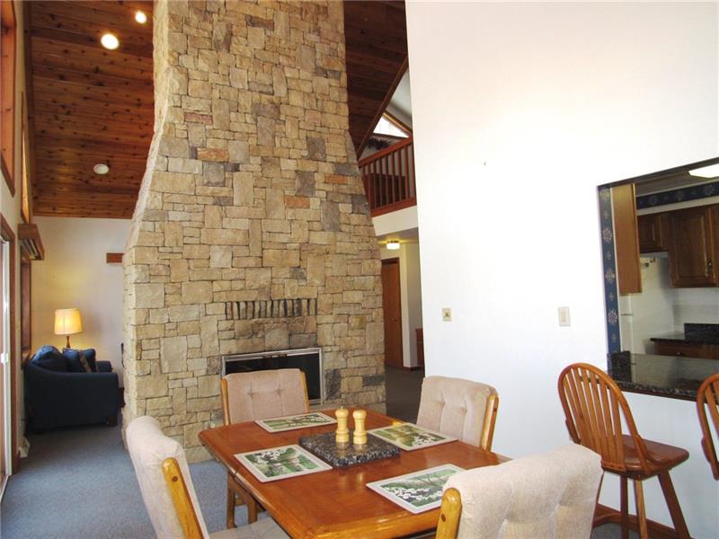 354 Lake Road Somerset, PA 15502 - Photo 5 of 25 Notice the floor-to-ceiling, over sized, mountain stone faced, wood burning fireplace! You'll see it opens up on both sides. It's the focal point of the dining and living rooms.
