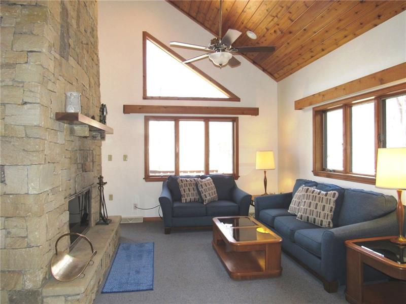354 Lake Road Somerset, PA 15502 - Photo 7 of 25 How about the knotty pine cathedral ceiling! The ceiling fan with light keeps the mountain air circulating and the heat from rising! All of the ceiling fans have remote controls The frames above the windows hide extra lighting.