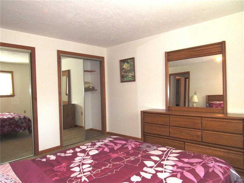 354 Lake Road Somerset, PA 15502 - Photo 9 of 25 On the left are two sets of double mirrored closet doors. In the mirror on the dresser you can see into the hallway.