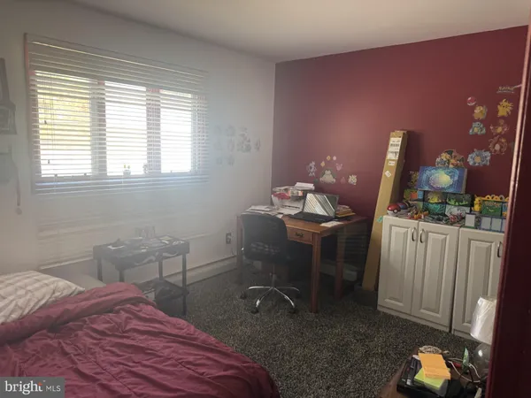 a room with furniture and musical instruments
