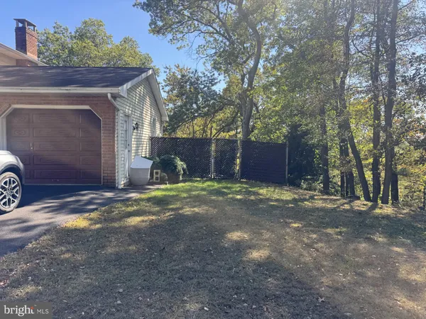 a view of a house with a yard and garage
