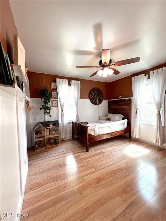 54340 Bracken Road Bridgeport, OH 43912 - Photo 14 of 29 Unfurnished bedroom featuring light hardwood / wood-style flooring, multiple windows, and ceiling fan