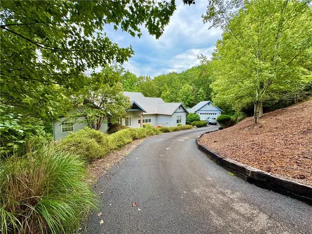 a view of a road with a yard