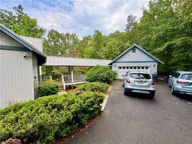 a view of a car parked in front of a house