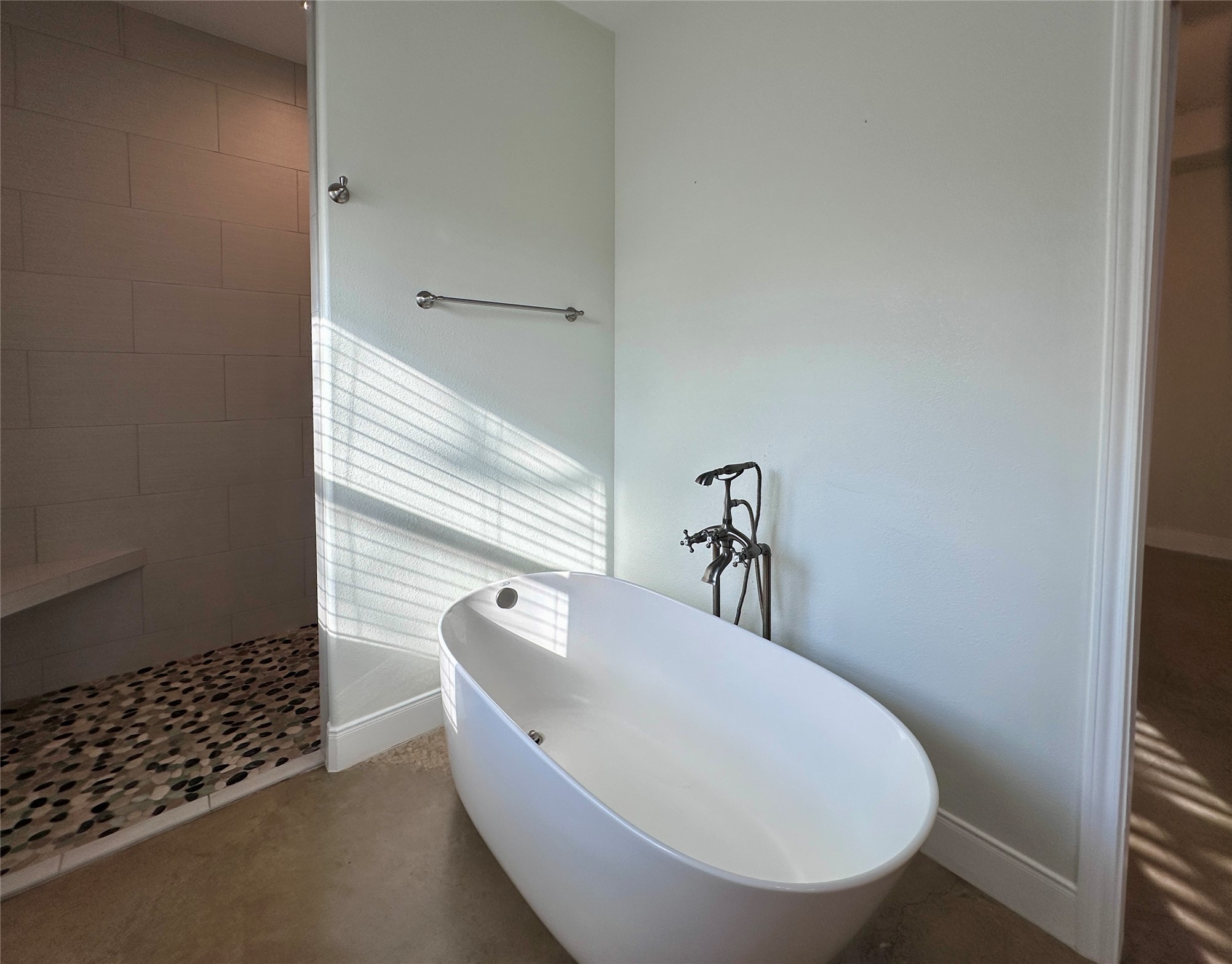 124 Pine Path Bastrop, TX 78602 - Photo 12 of 31 Bathroom featuring tiled shower, a freestanding bath tub