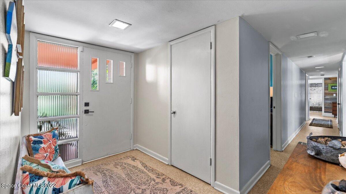 912 Bali Road Cocoa Beach, FL 32931 - Photo 12 of 48 a view of an entryway with wooden floor