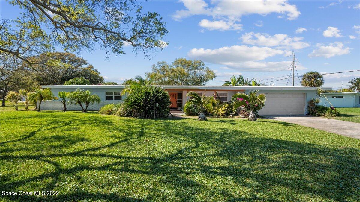 912 Bali Road Cocoa Beach, FL 32931 - Photo 2 of 48 a view of a garden