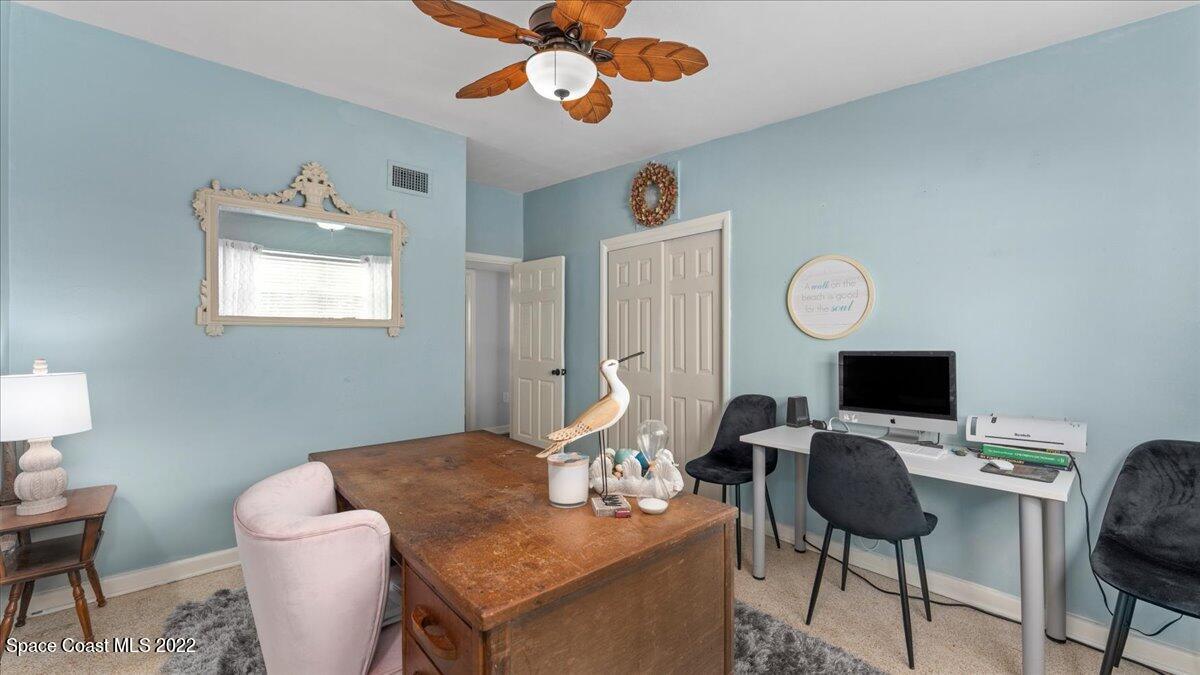 912 Bali Road Cocoa Beach, FL 32931 - Photo 29 of 48 a view of a workspace with furniture