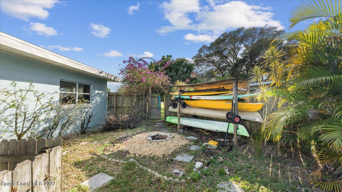 912 Bali Road Cocoa Beach, FL 32931 - Photo 38 of 48 a house view with a backyard space