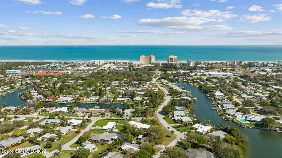 912 Bali Road Cocoa Beach, FL 32931 - Photo 40 of 48 an aerial view of a residential houses with outdoor space and trees