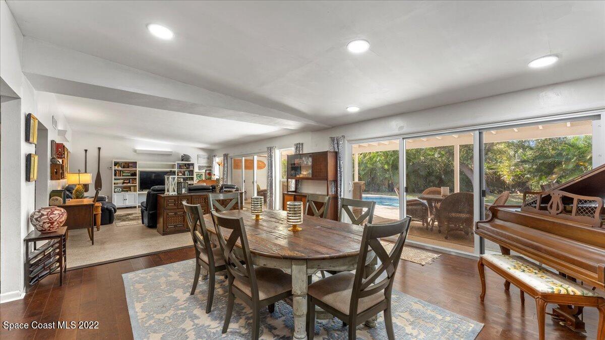 912 Bali Road Cocoa Beach, FL 32931 - Photo 4 of 48 a view of a dining room with furniture window and outside view
