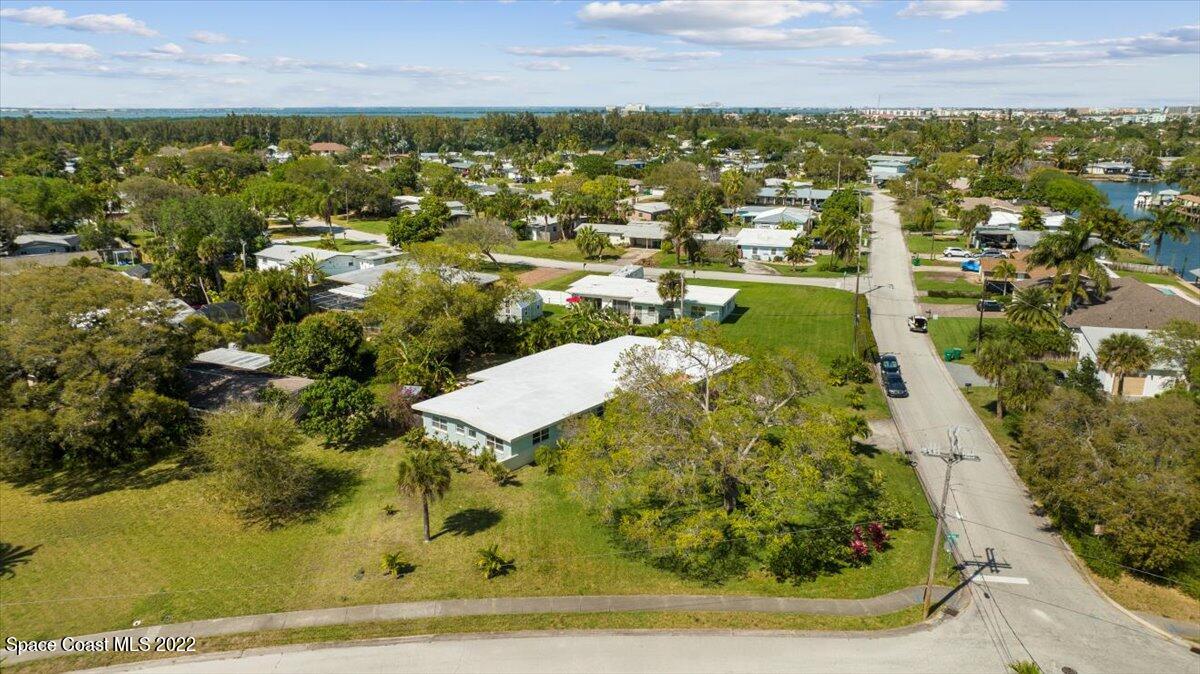 912 Bali Road Cocoa Beach, FL 32931 - Photo 45 of 48 an aerial view of residential houses with outdoor space