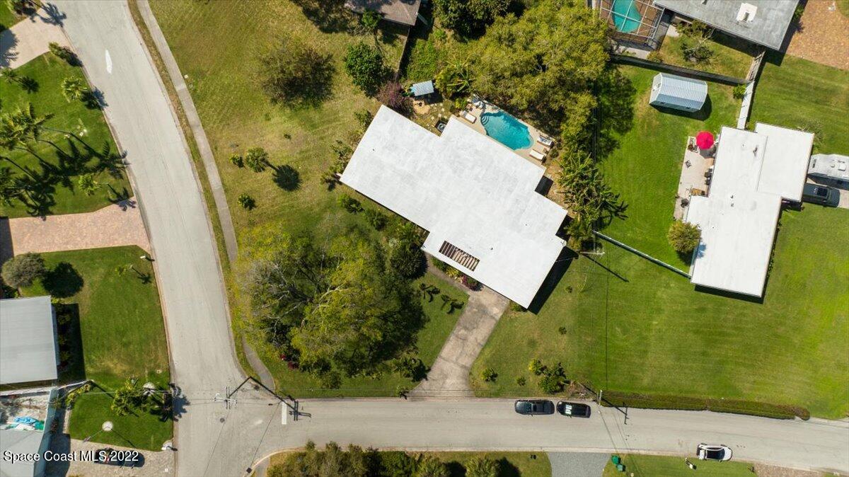 912 Bali Road Cocoa Beach, FL 32931 - Photo 46 of 48 an aerial view of a house with a garden