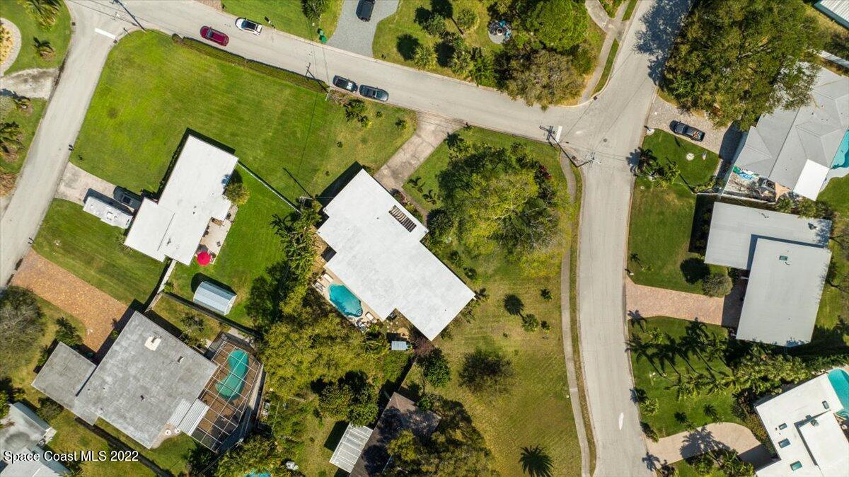 912 Bali Road Cocoa Beach, FL 32931 - Photo 47 of 48 an aerial view of a house with outdoor space and a lake view