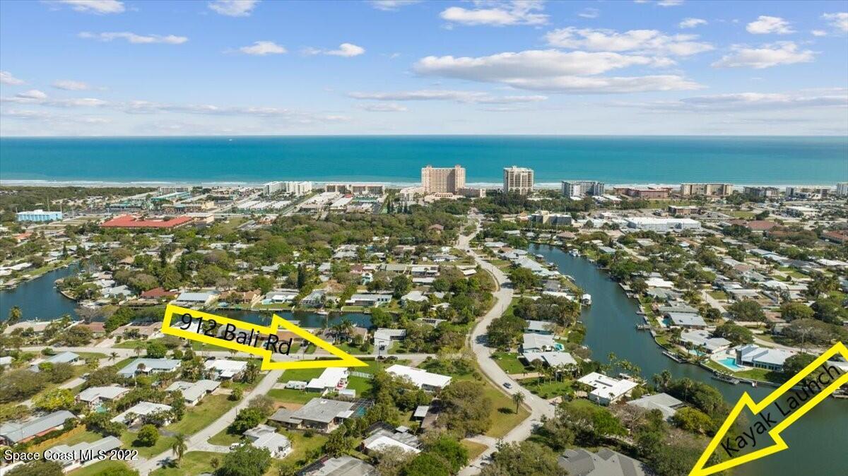 912 Bali Road Cocoa Beach, FL 32931 - Photo 5 of 48 an aerial view of residential houses with outdoor space