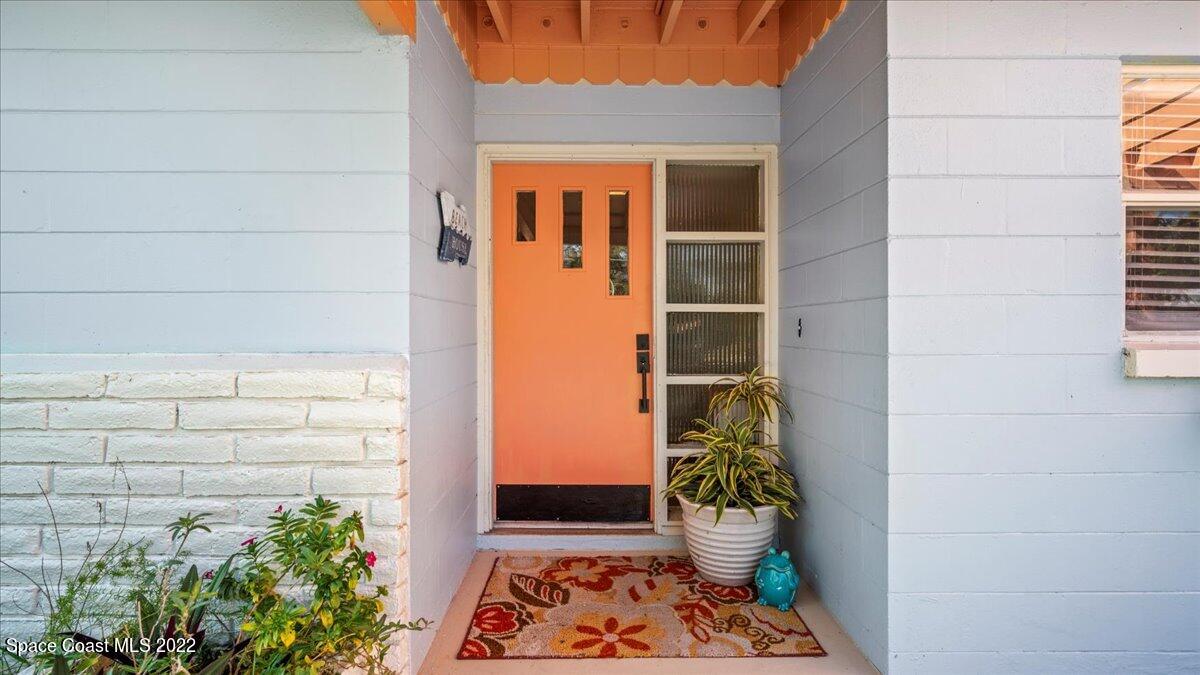 912 Bali Road Cocoa Beach, FL 32931 - Photo 8 of 48 a view of potted plant in front of a door