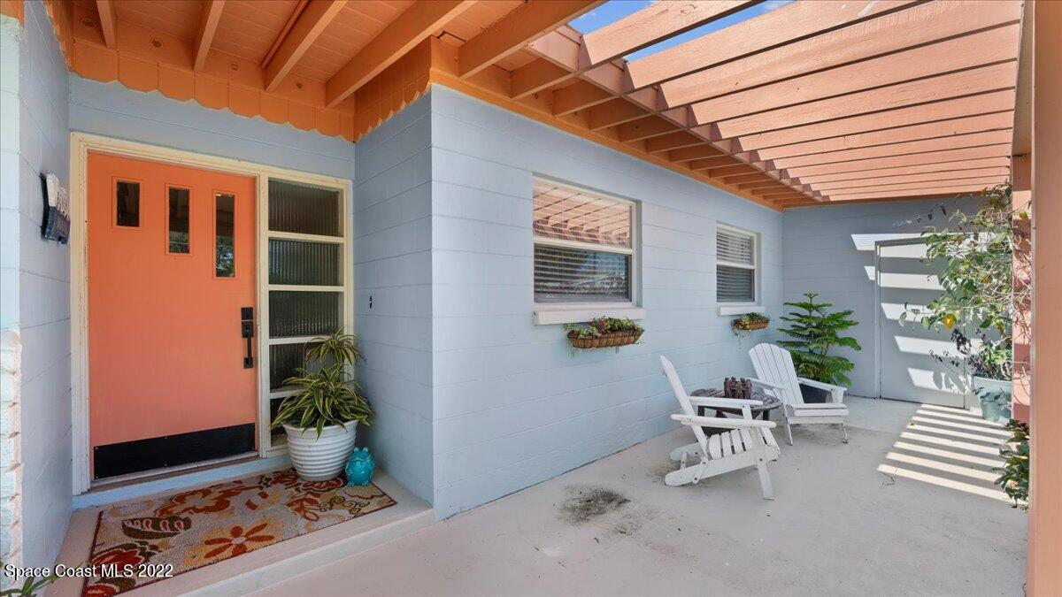 912 Bali Road Cocoa Beach, FL 32931 - Photo 9 of 48 a outdoor space with chairs