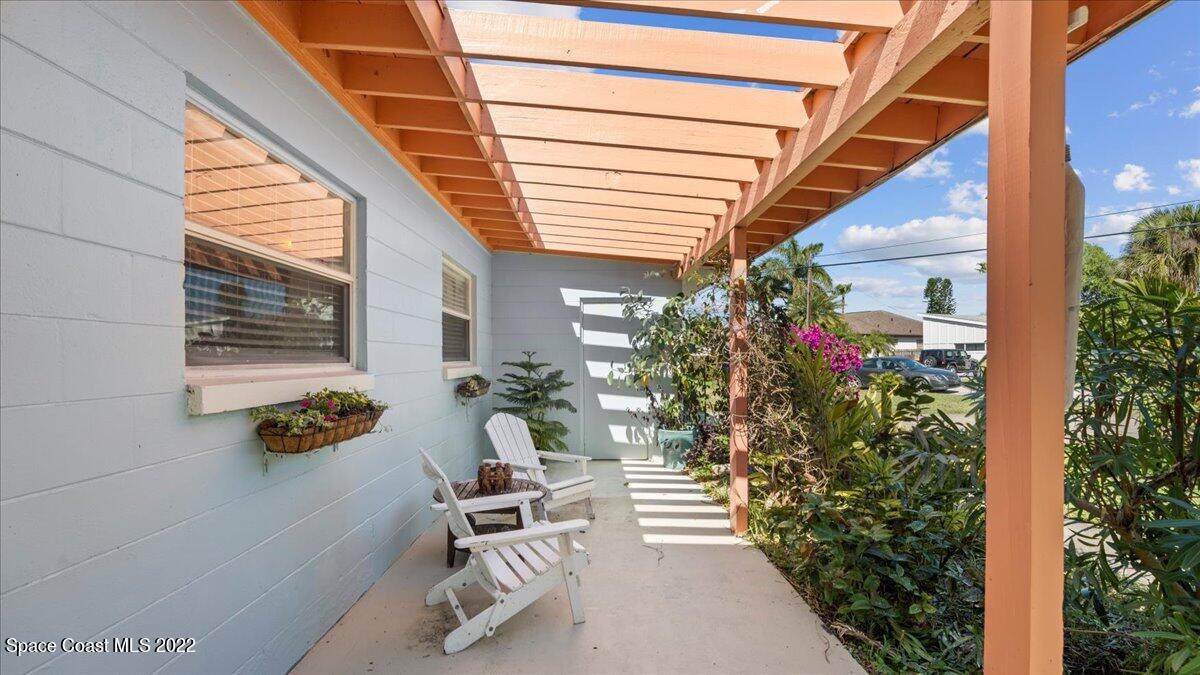 912 Bali Road Cocoa Beach, FL 32931 - Photo 10 of 48 a balcony with plants and flowers