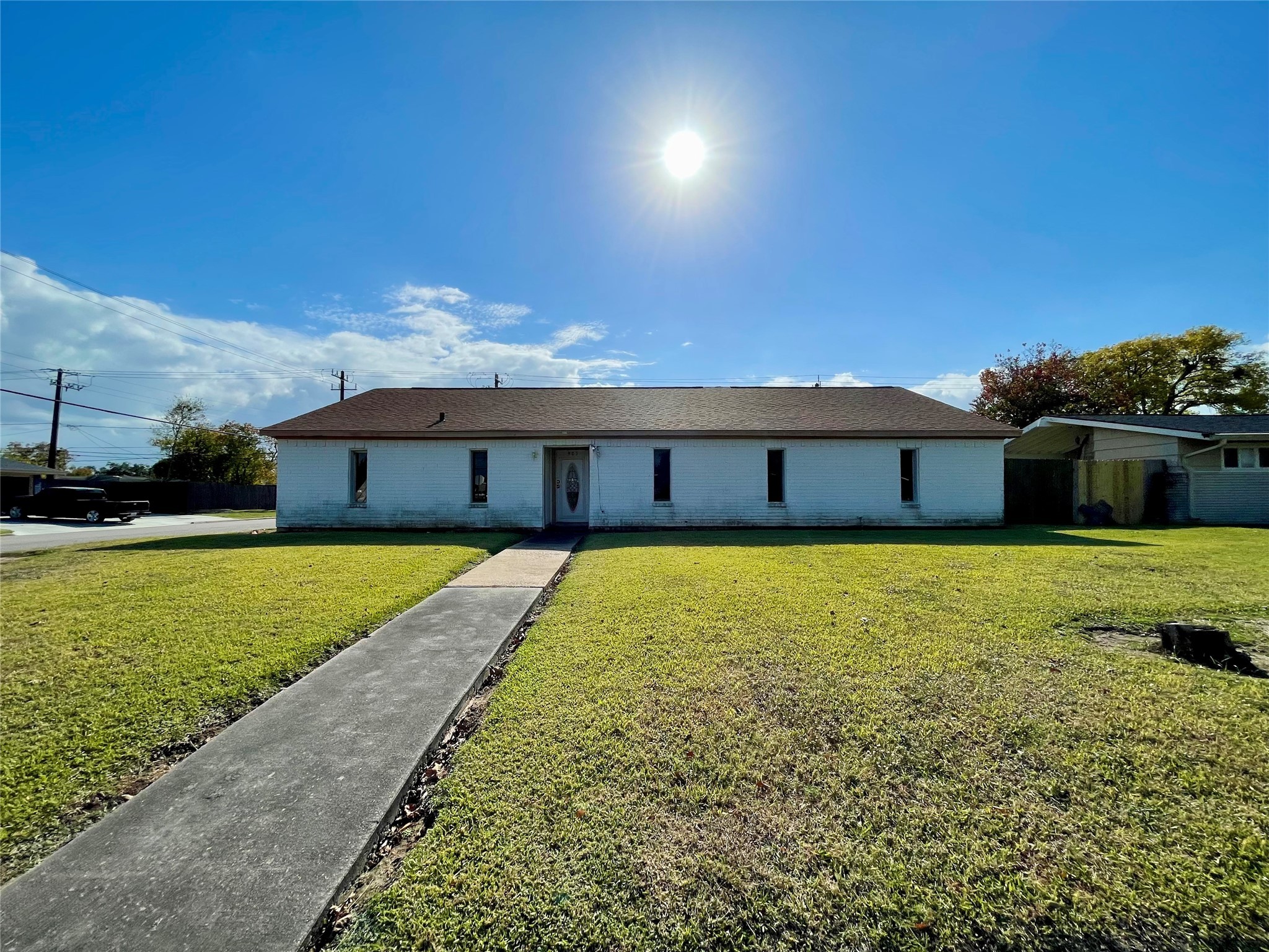 903 West 8th Street Freeport, TX 77541 - Photo 2 of 20 a front view of a house with a yard